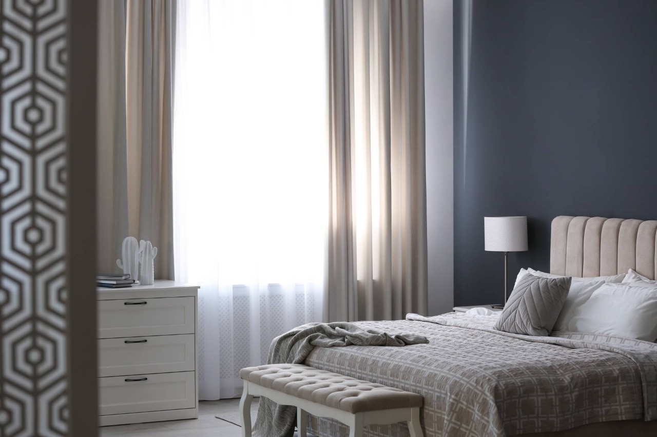 Custom drapery hanging in a bedroom near St. Petersburg, FL